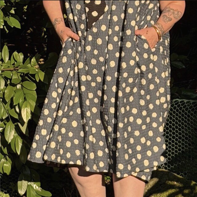 A customer's handmade dress sewn from navy polka-dot seersucker