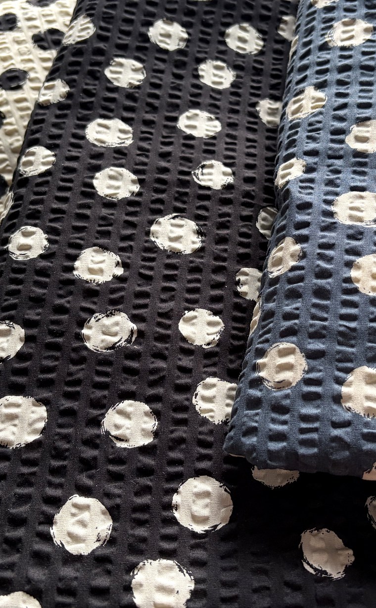 Cream, black and navy seersucker fabrics with painted polka dots